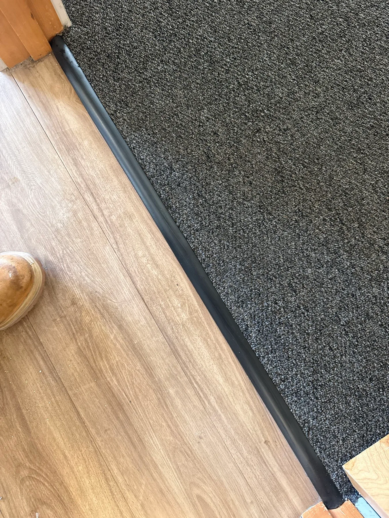New transition bar between bedroom carpet and hard flooring